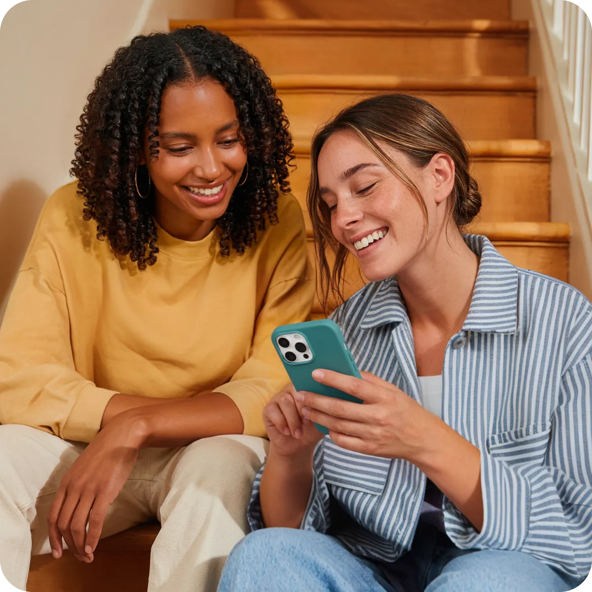 two girls looking at phone